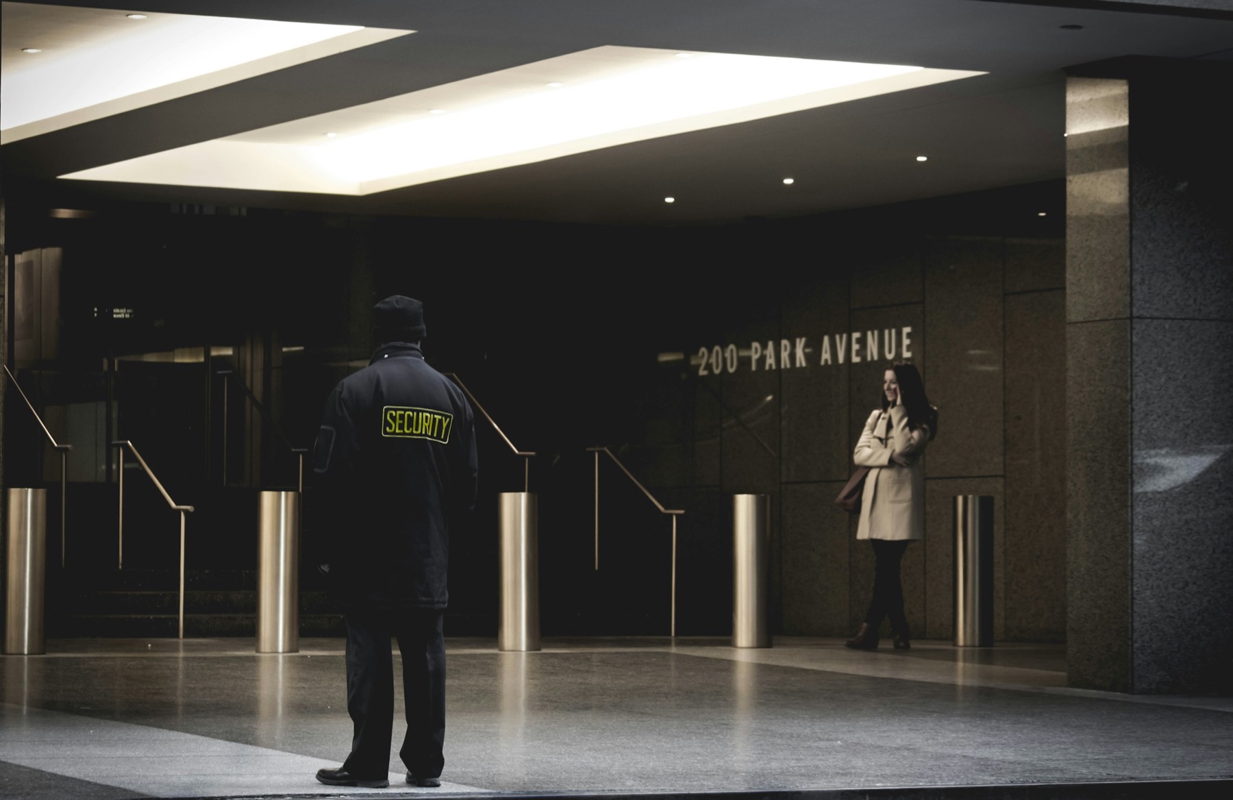 Professional Onyx Guardian officer maintaining a visible front-of-house security presence